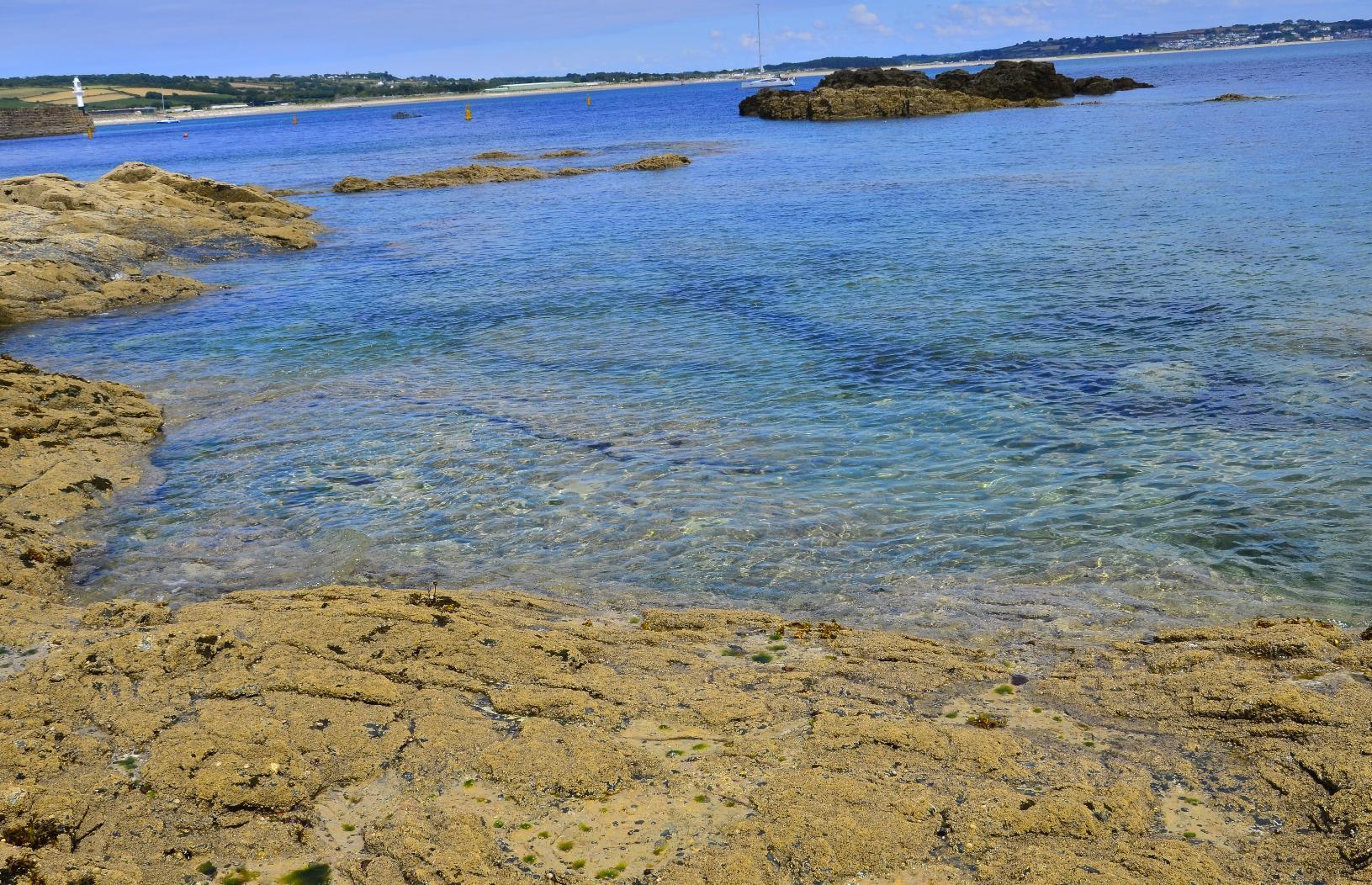 Sea appearing blue and green in patches