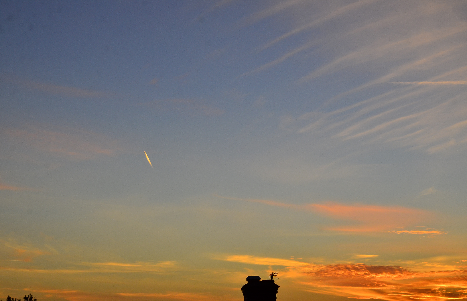 Contrail at sunset